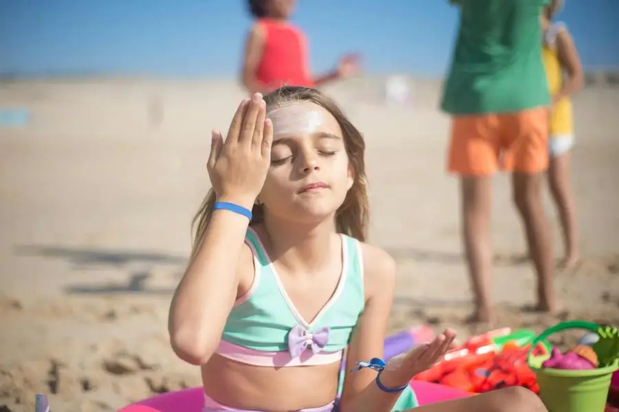 Cute Girl Applying Sunscreen of Her Face by Kampus Production