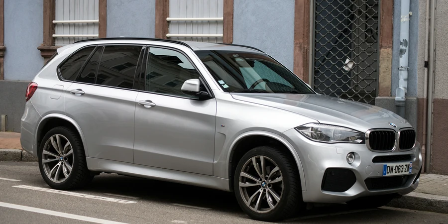 Front view of grey BMW X3 SUV car parked in the street