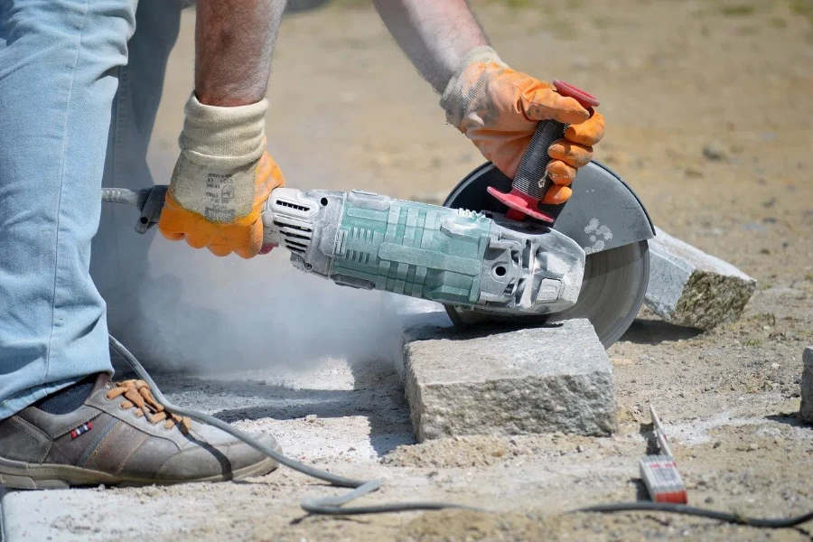 Grinder cutting concrete