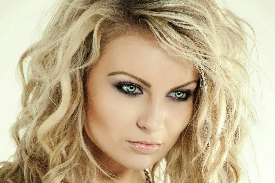 Close-up Photography of Woman Wearing Gold-colored Necklace