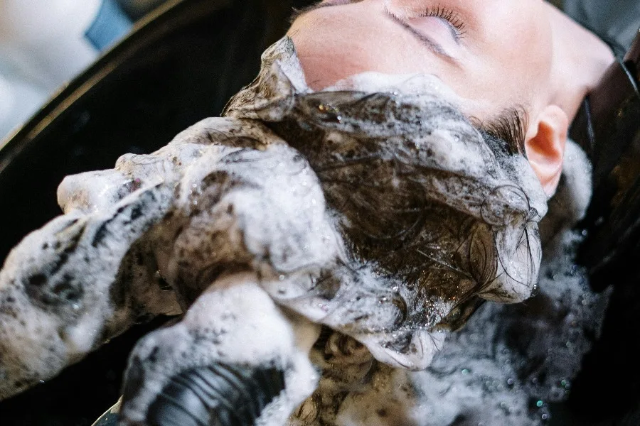 Woman Getting Her Hair Shampoo