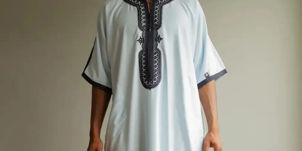 Man rocking a white thobe with interesting details