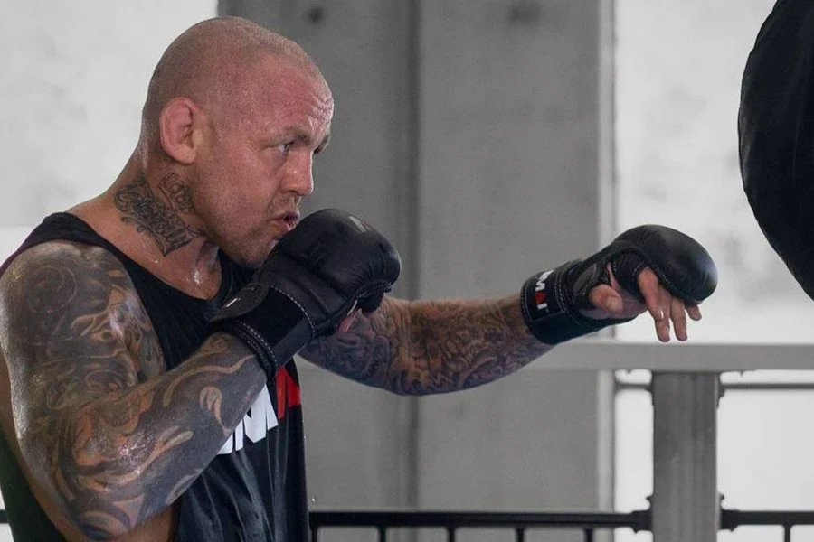 Man training with a pair of MMA gloves