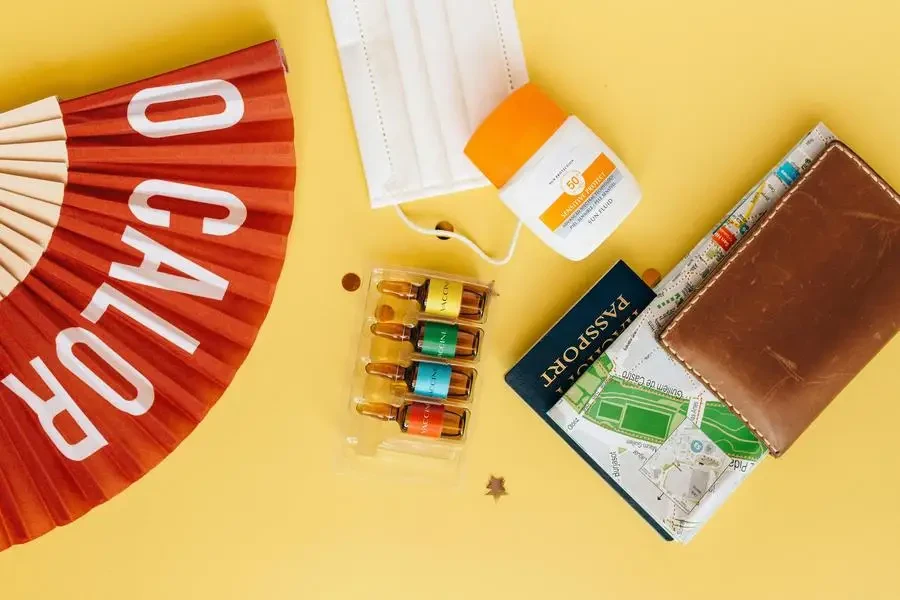 Map and Passport in a Leather Wallet by Nataliya Vaitkevich