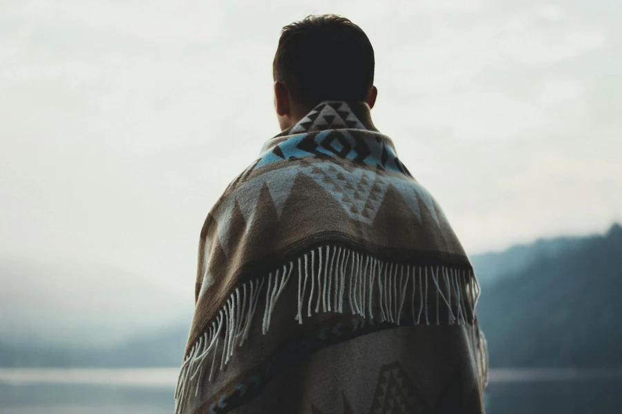 Person Wearing Brown Tribal Print Scarf
