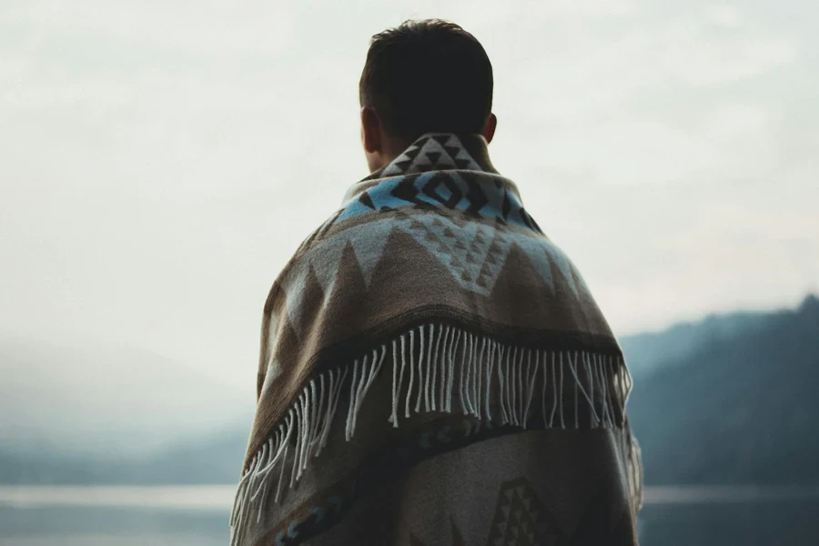 Person Wearing Brown Tribal Print Scarf 