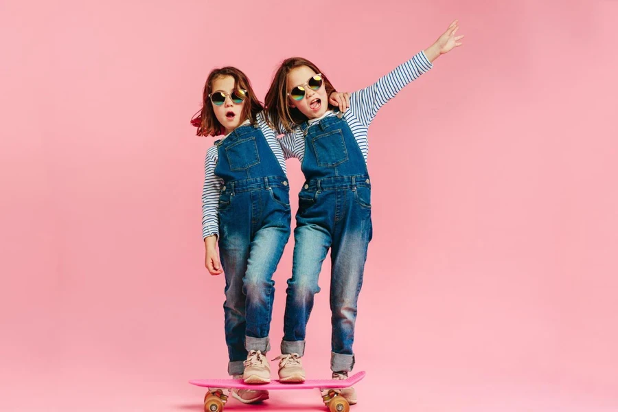 Stylish cute girls with skateboard