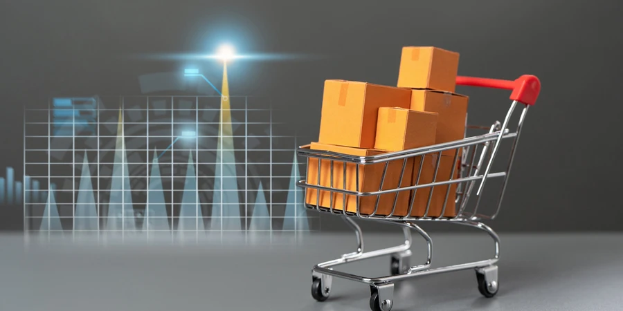 Тележка супермаркета с коробками товаров и графиками роста экономических показателей