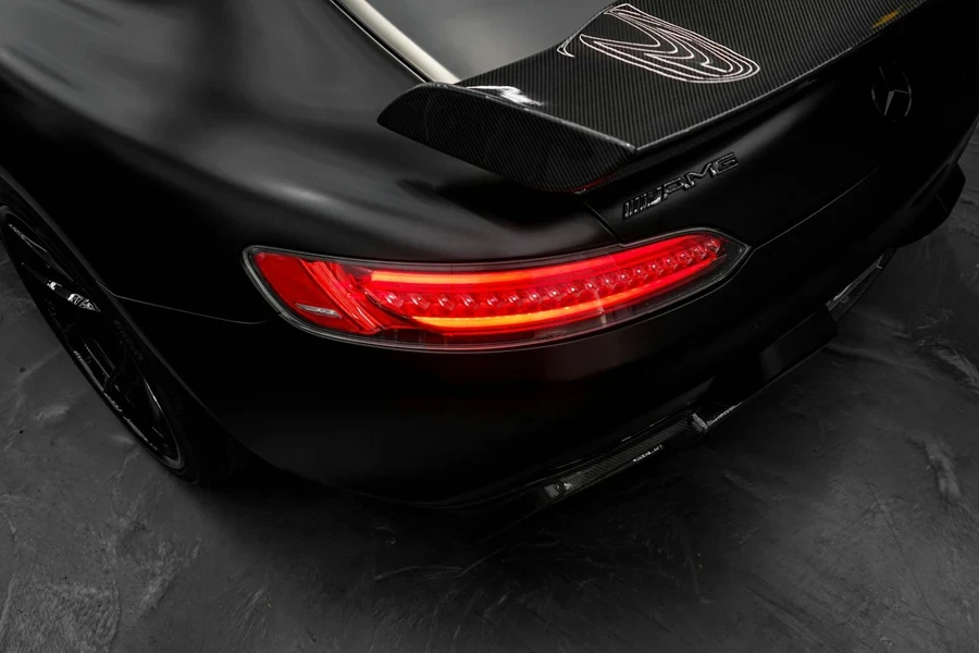 The Tail Light of a Black Car