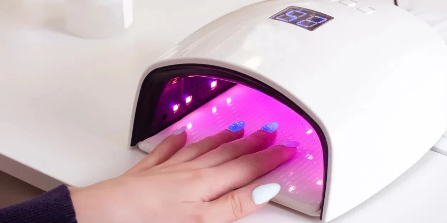 There is a UV nail lamp on the table