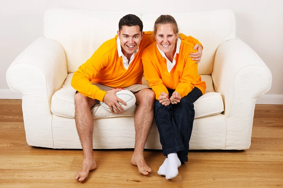 A caucasian couple enjoying a game of rugby