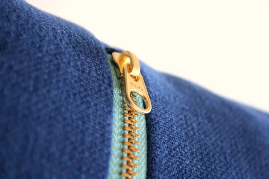 A close view of zipper pants on a white background