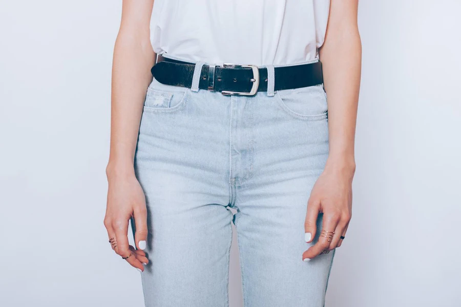 blue high waist jeans with leather belt