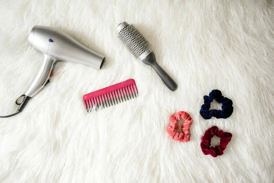 Grey Hair Blower Near Pink Hair Combs