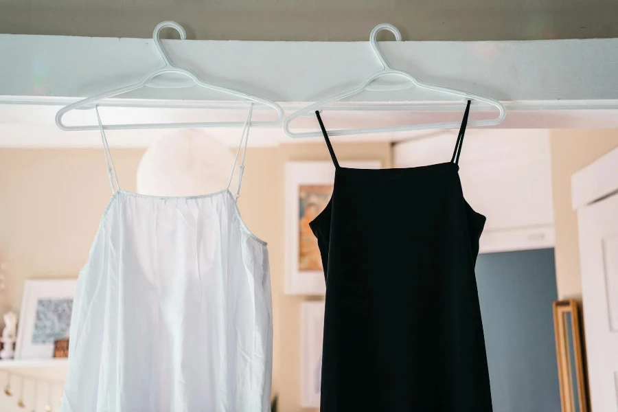 White and Black Dresses on Coat Hangers