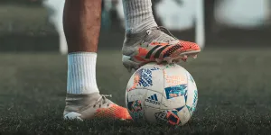 A Player Stepping on a Soccer Ball