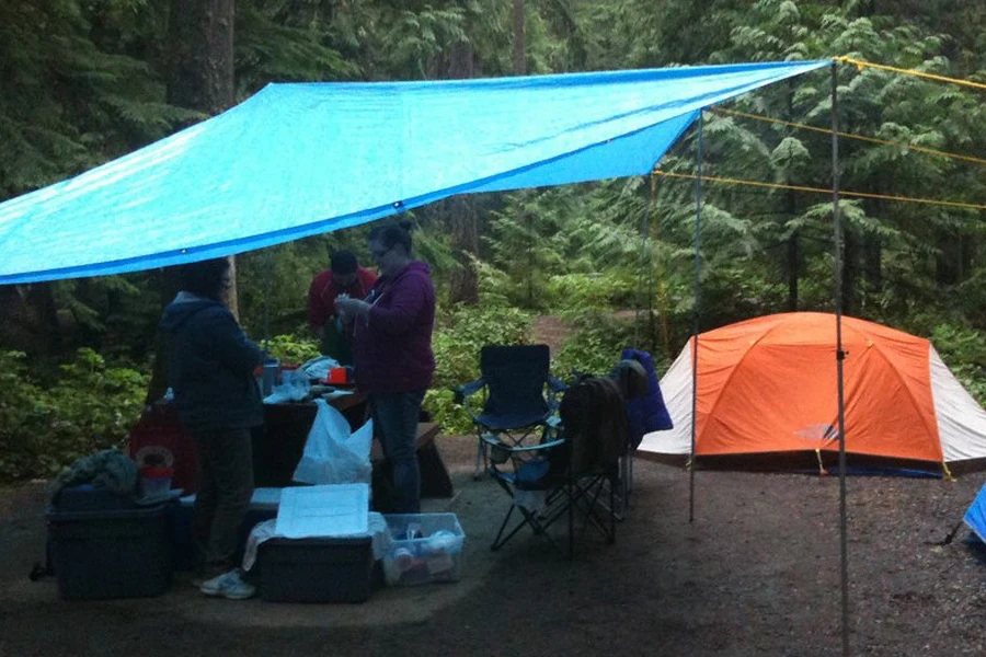 A blue sun shelter with waterproofing qualities