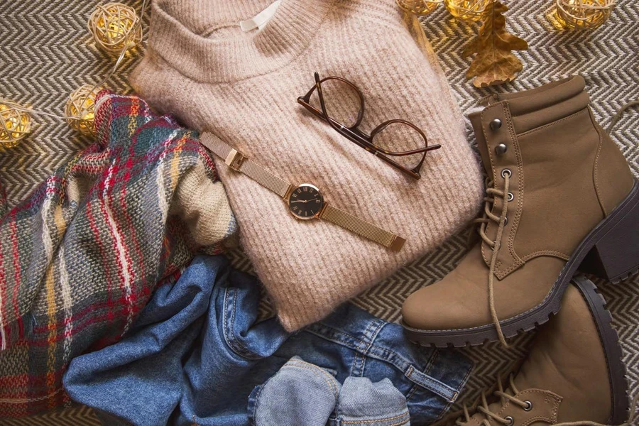 Autumn clothing outfit with sweater, jeans and boots