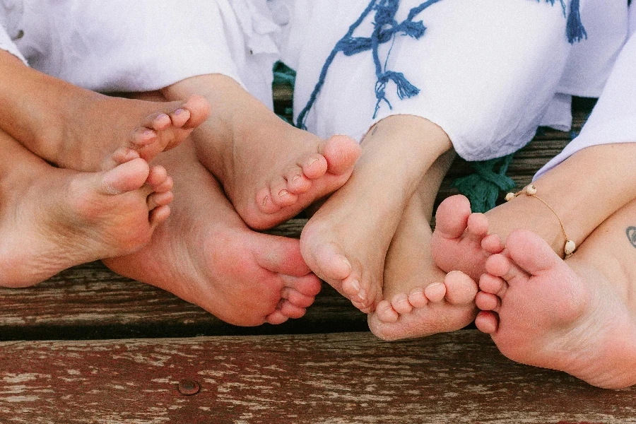 Feet of Women Sitting Barefoot