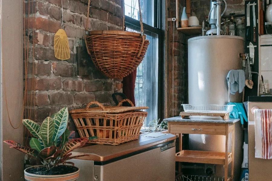 Interior of kitchen with brick wall decorated with wicker baskets