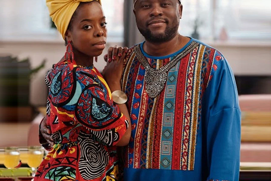 Man and woman wearing bold printed kaftans