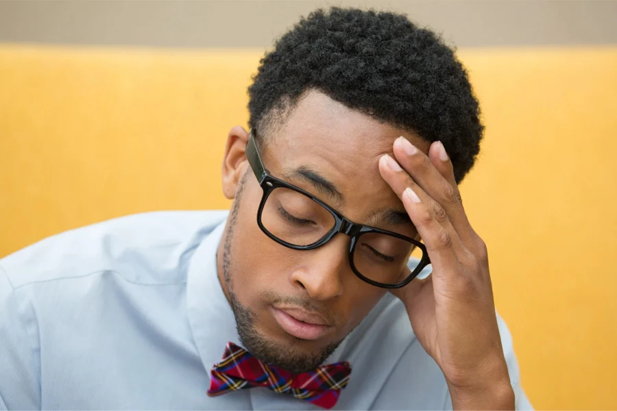 Man putting a hand on his head