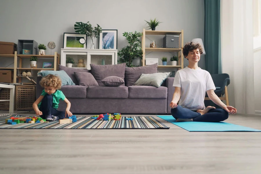 Mother Practicing Yoga and Boy Playing near