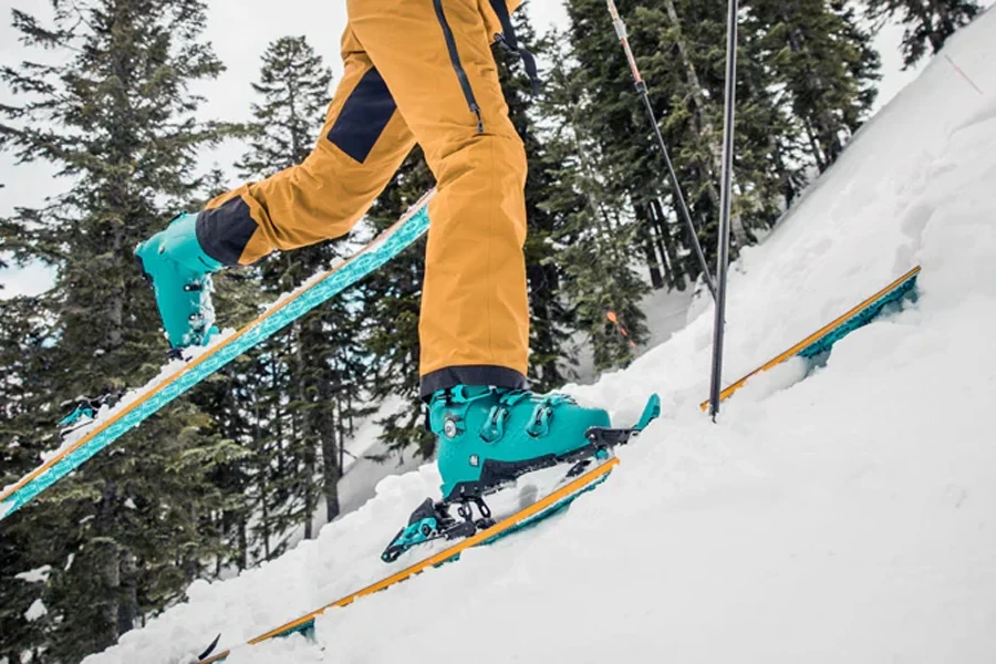 Person ascending a backcountry slope in lightweight gear