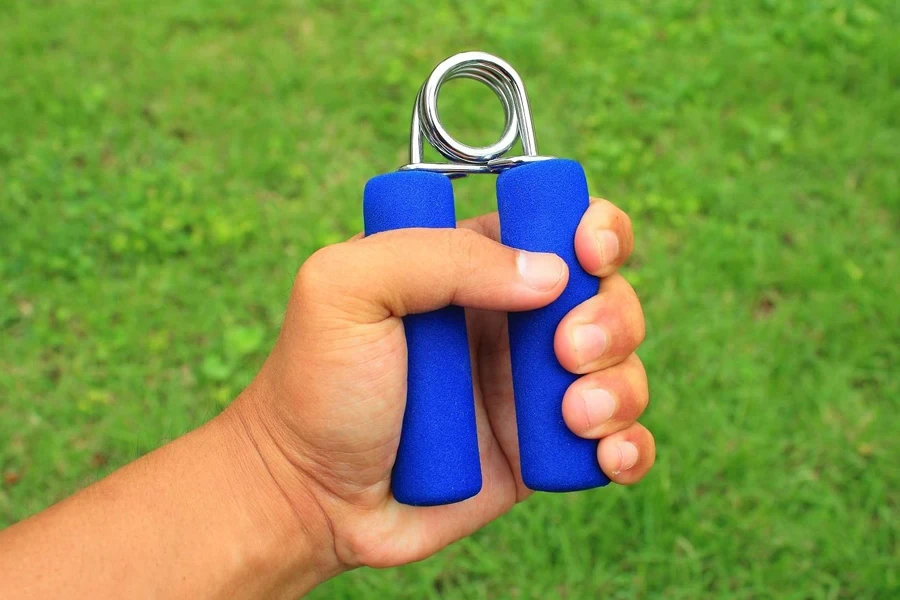 Person using a blue grip trainer