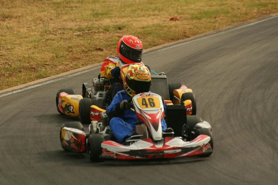 Racers Driving Go Karts on Asphalt Road