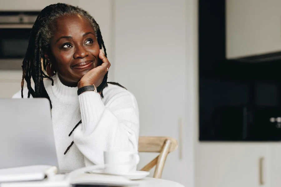 Senior businesswoman running online store in her home office.