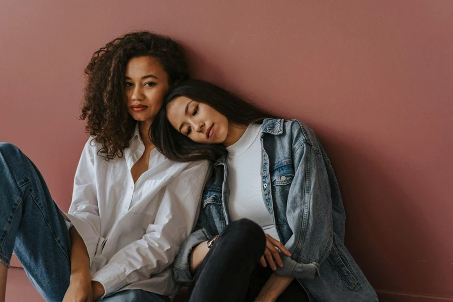 Two Women Leaning on Each Other