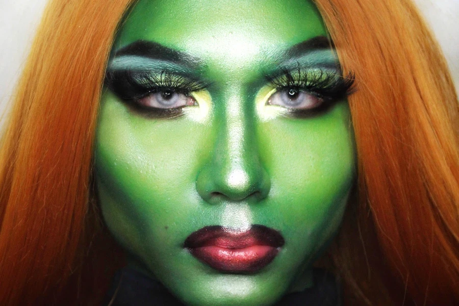 Woman with green paint on face