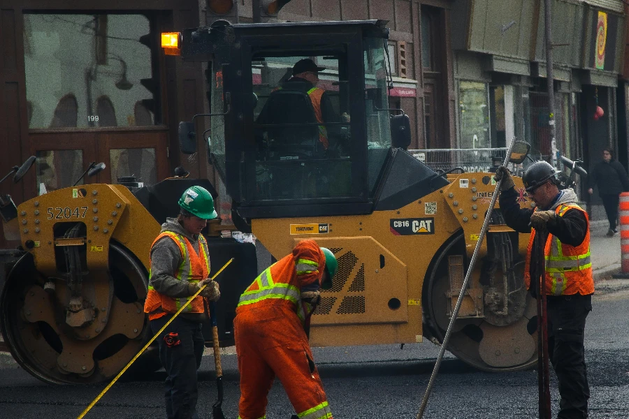 Workers and Road Roller on Street