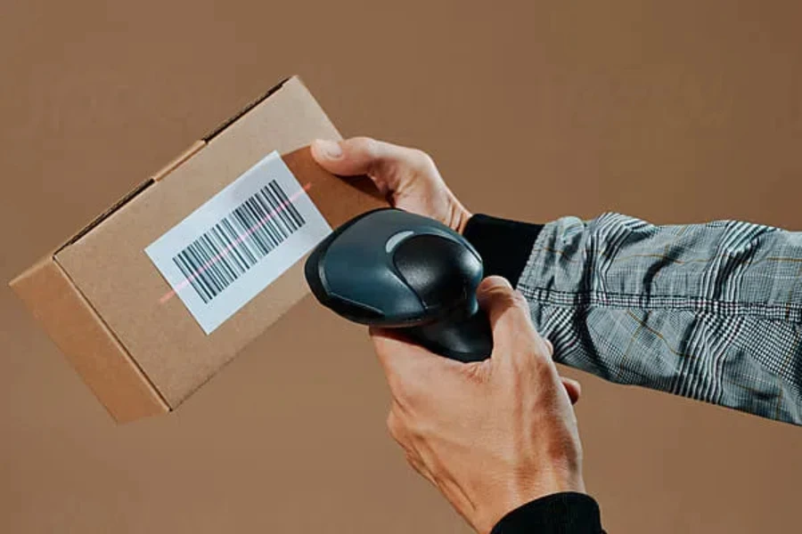 man scanning the barcode of a package