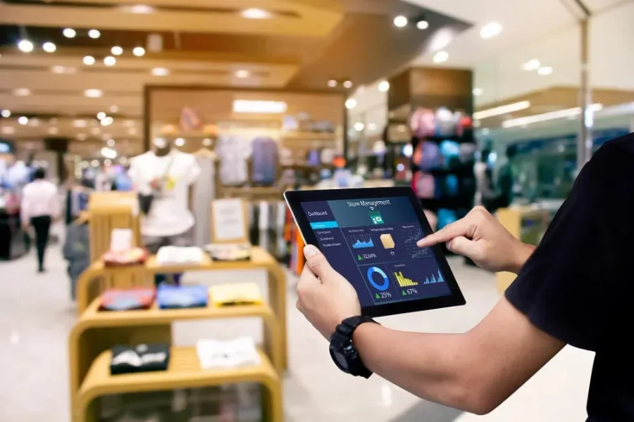 Man checking store analytics on a tablet