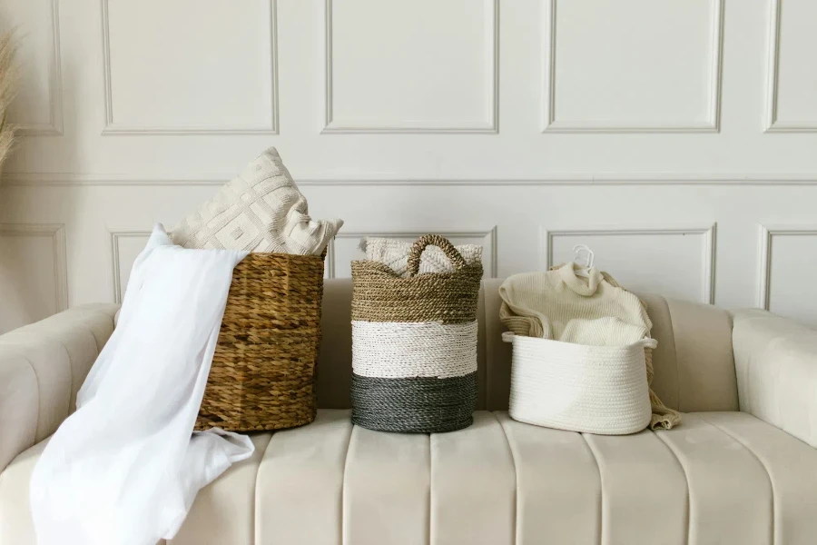 Three wicker basket styles displayed on a sofa