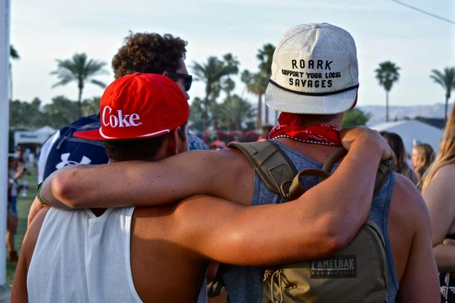 two young men at a music festival