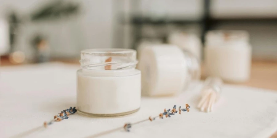 A Candle Near Dried Flowers