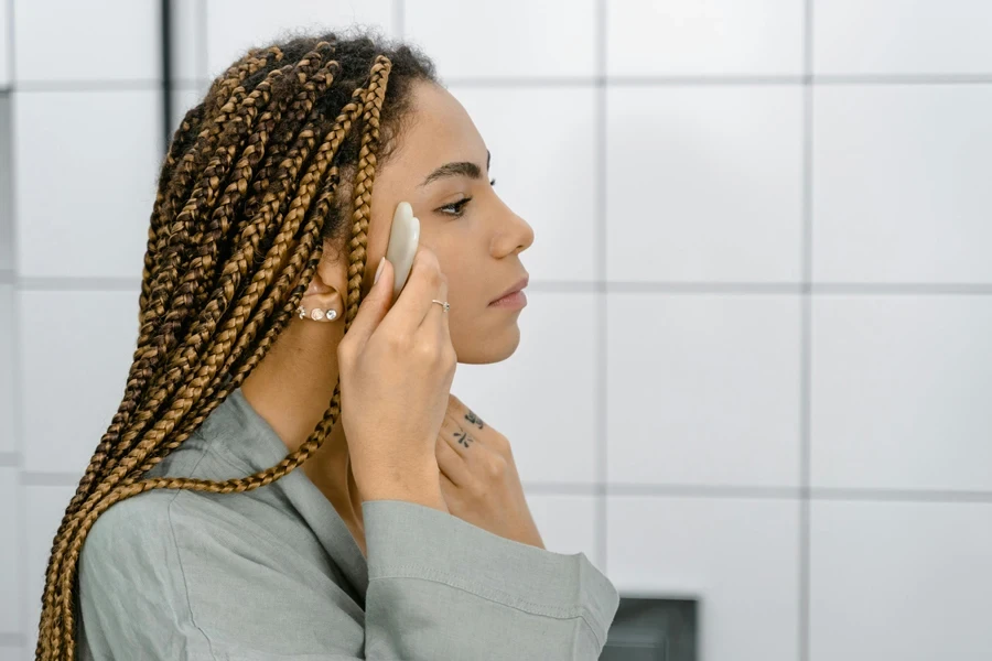 A Side View of a Woman Doing Her Skin Care