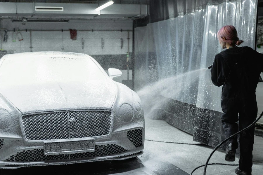 A Woman Cleaning a Car