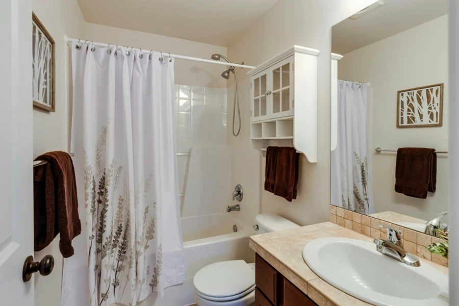 A bathroom with a shower and sink