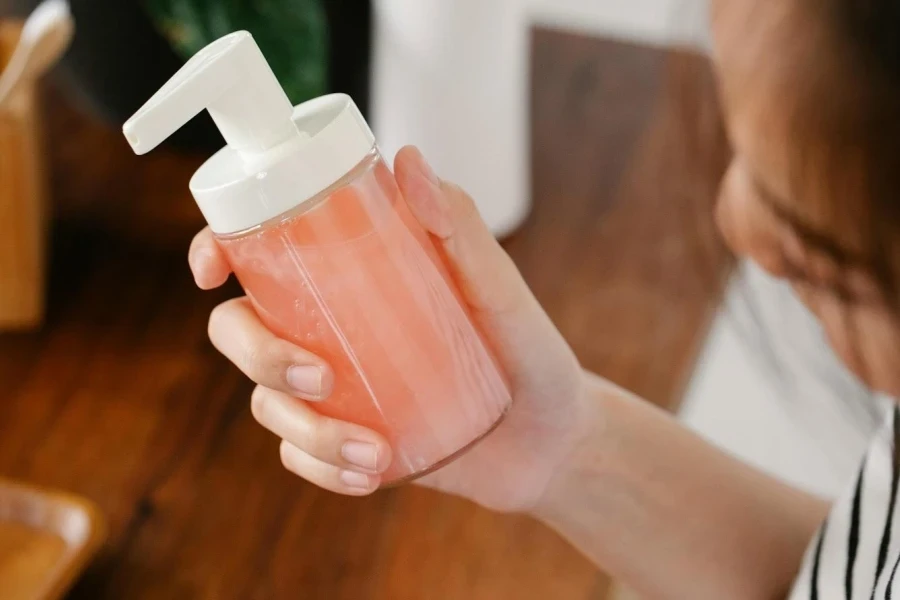 A lady holding a scented handwash