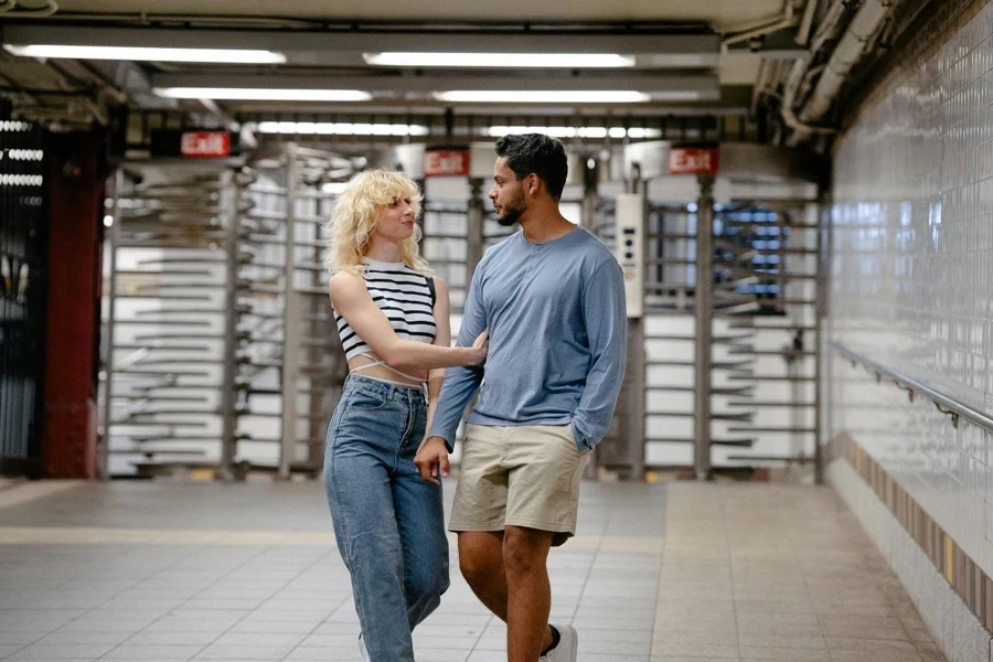 Couple Walking Together from Metro Exit