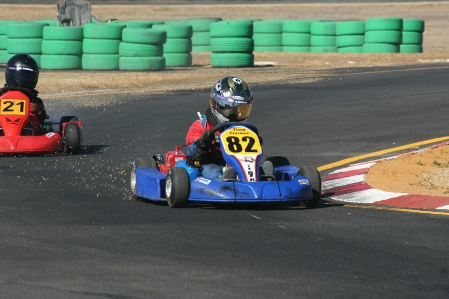 Drivers Racing in Go Karts on a Circuit