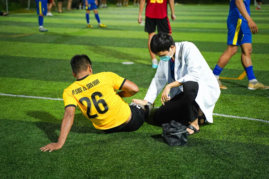 Injured Soccer Player with a Doctor