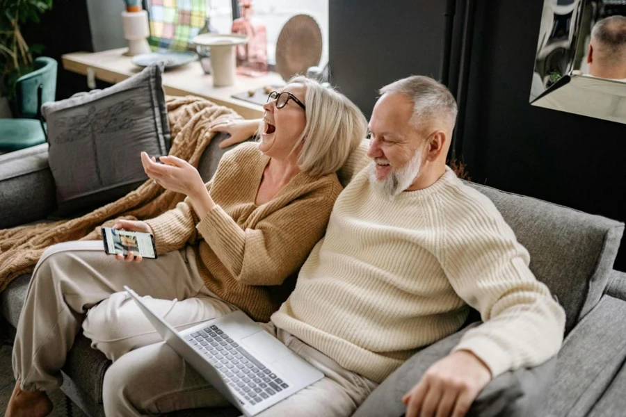 Old Couple Sitting Together Laughing