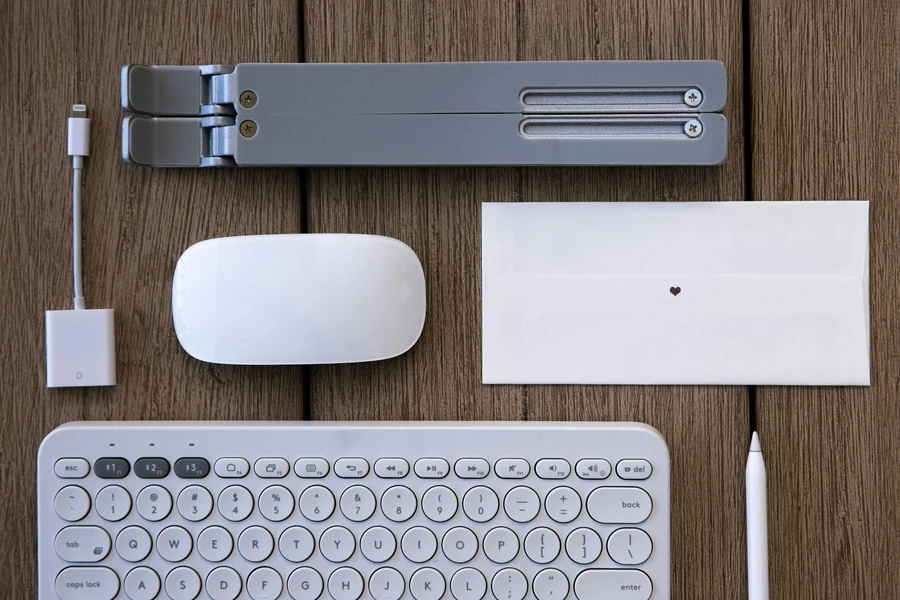 Overhead Shot of an Adapter Near a Keyboard