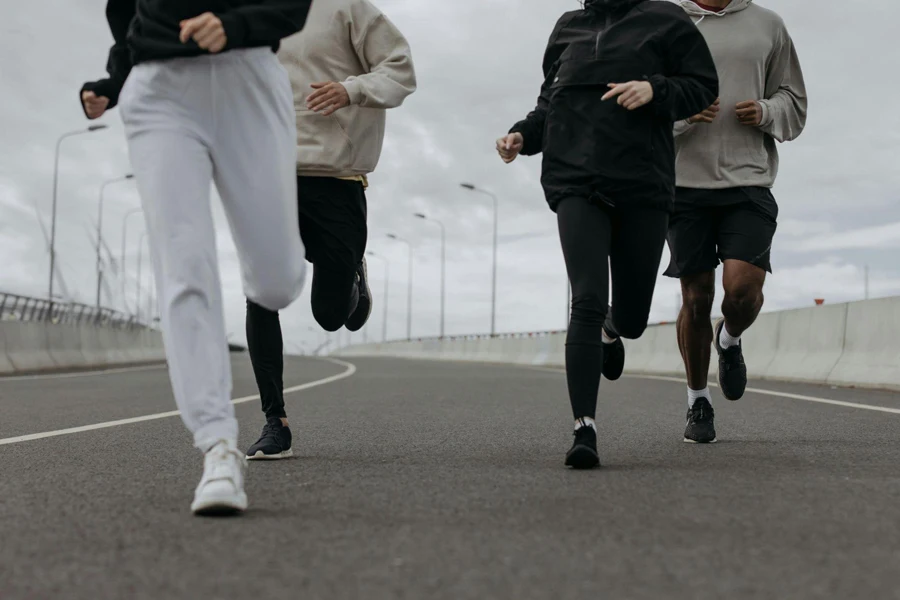 People Jugging Together on a Road