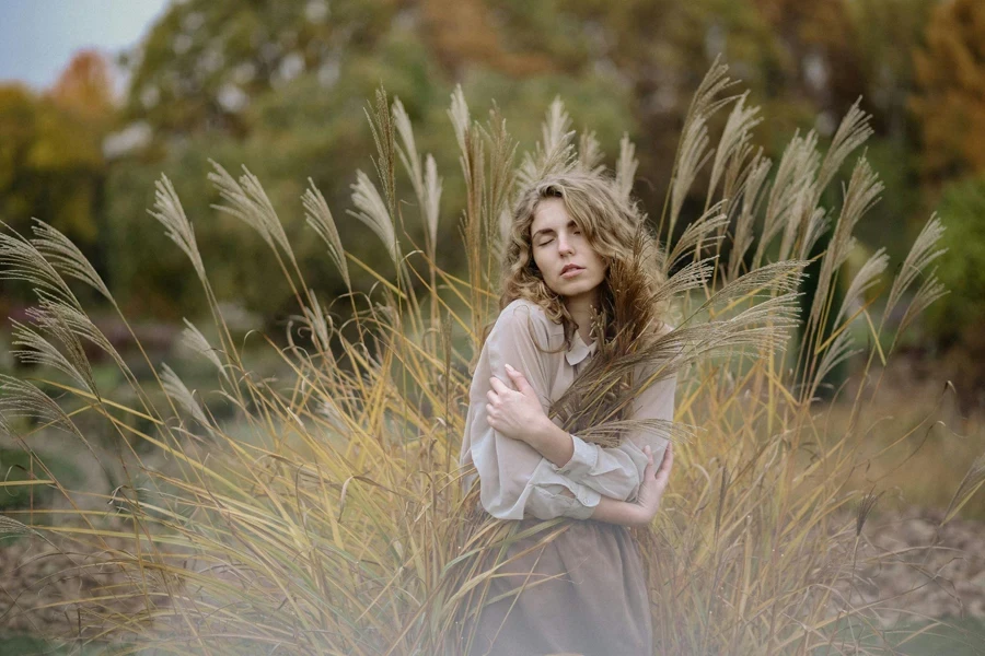 Photo Of Woman Standing On Wheat Field